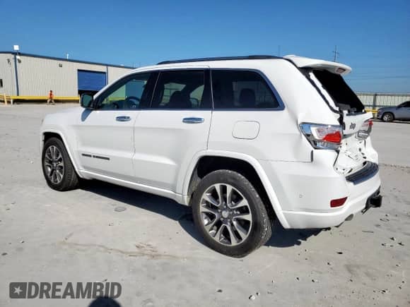 2017 Jeep Grand Cherokee Overland with VIN 1C4RJECG4HC965657, listed as a Copart auction lot 84400635 with 141,055 mi miles and Salvage title. Bid and sale history available at DreamBid. Image 2.