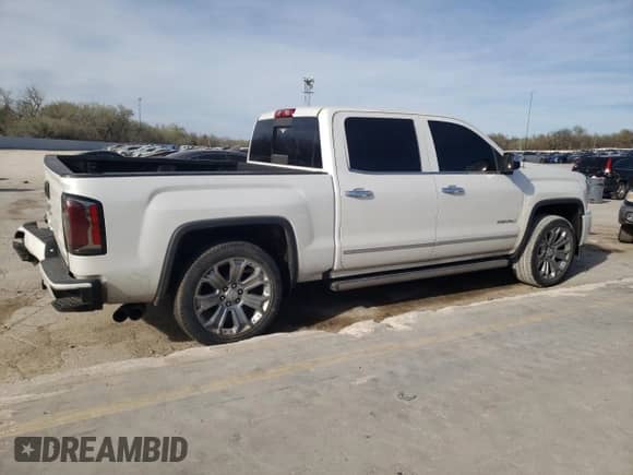 2017 GMC Sierra 1500 Denali with VIN 3GTP1PEC1HG258526, listed as a Copart auction lot 50223725 with 130,337 mi miles and Salvage title. Bid and sale history available at DreamBid. Image 3.