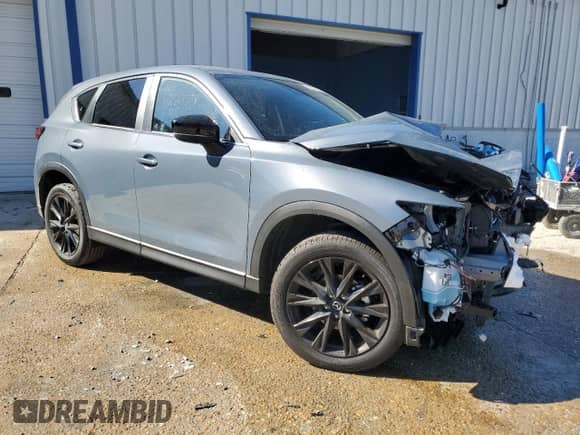 2025 Mazda CX-5 S Carbon Edition z VIN JM3KFBCM6S0679834, wystawiony jako Copart lot #87410845 z przebiegiem 13 497 mil mil oraz Czysty tytuł • Clean title. Historia ofert i sprzedaży dostępna na DreamBid. Obrazek 4.