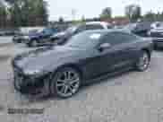 2018 Ford Mustang EcoBoost with VIN 1FA6P8TH0J5176935, listed as a IAAI auction lot 43464740 with 94,367 mi miles and . Bid and sale history available at DreamBid. Image 2.