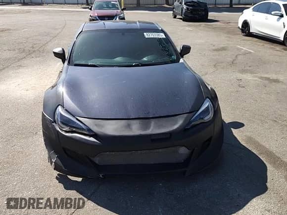 2013 Scion FR-S with VIN JF1ZNAA19D2702498, listed as a Copart auction lot 82703385 with 92,951 mi miles and Salvage title. Bid and sale history available at DreamBid. Image 14.