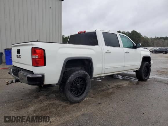 2015 GMC Sierra 1500 SLE with VIN 3GTU2UEC7FG219175, listed as a Copart auction lot 81682135 with 122,574 mi miles and Salvage title. Bid and sale history available at DreamBid. Image 3.