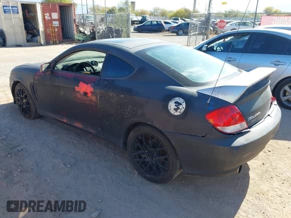 2005 Hyundai Tiburon GS с VIN KMHHM65D65U157713, выставлен на аукционе IAAI как лот 42039826 с пробегом 184 368 миль миль и . История ставок и продаж доступна на DreamBid. Изображение 3.
