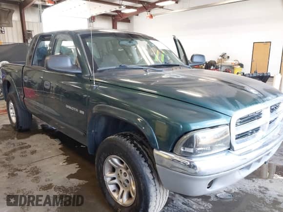 2001 Dodge Dakota Sport with VIN 1B7HG2AN31S318690, listed as a IAAI auction lot 42766545 with 212,865 mi miles and . Bid and sale history available at DreamBid. Image 1.
