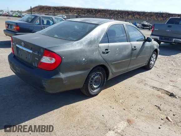 2004 Toyota Camry LE with VIN JTDBE32K940285801, listed as a IAAI auction lot 42335640 with 109,719 mi miles and . Bid and sale history available at DreamBid. Image 4.