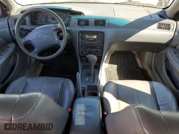 1999 Toyota Camry LE z VIN JT2BG22K9X0264433, wystawiony jako Copart lot #71749095 z przebiegiem 231 764 mil mil oraz Czysty tytuł • Clean title. Historia ofert i sprzedaży dostępna na DreamBid. Obrazek 8.