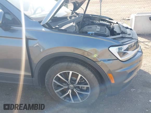 2021 Volkswagen Tiguan S z VIN 3VV0B7AX3MM038342, wystawiony jako IAAI lot #42545665 z przebiegiem 66 809 mil mil oraz . Historia ofert i sprzedaży dostępna na DreamBid. Obrazek 18.