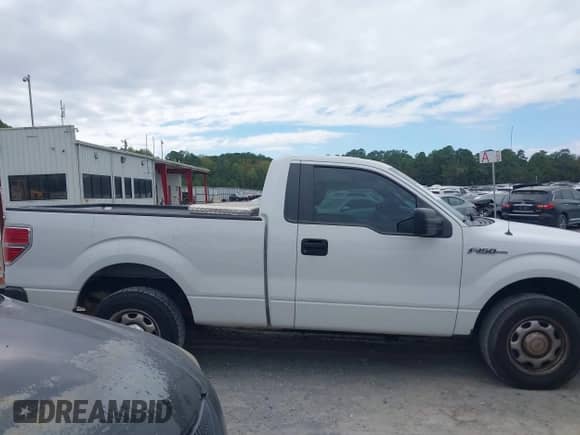 2014 Ford F-150 XL with VIN 1FTMF1CM7EFB62801, listed as a IAAI auction lot 43323235 with 186,000 mi miles and . Bid and sale history available at DreamBid. Image 13.