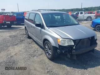 2013 Dodge Grand Caravan SE with VIN 2C4RDGBG9DR799528, listed as a IAAI auction lot 42894435 with 142,036 mi miles and . Bid and sale history available at DreamBid. Image 1.