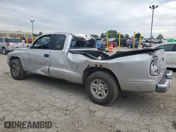 2001 Dodge Dakota Sport с VIN 1B7GL22N61S172663, выставлен на аукционе Copart как лот 58068695 с пробегом 128 576 миль миль и Списание • Salvage title. История ставок и продаж доступна на DreamBid. Изображение 2.