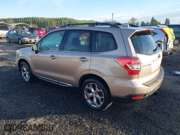 2016 Subaru Forester Touring with VIN JF2SJAXC9GH556784, listed as a IAAI auction lot 43378533 with 72,771 mi miles and . Bid and sale history available at DreamBid. Image 3.