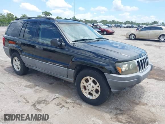 2002 Jeep Grand Cherokee Laredo z VIN 1J4GX48S22C226527, wystawiony jako IAAI lot #42630457 z przebiegiem 197 333 mil mil oraz . Historia ofert i sprzedaży dostępna na DreamBid. Obrazek 1.