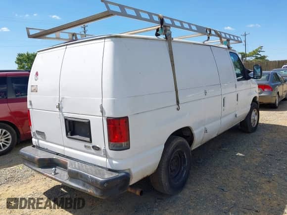 2010 Ford Econoline Cargo Commercial with VIN 1FTNE1EWXADA67094, listed as a IAAI auction lot 43173889 with 202,853 mi miles and . Bid and sale history available at DreamBid. Image 4.