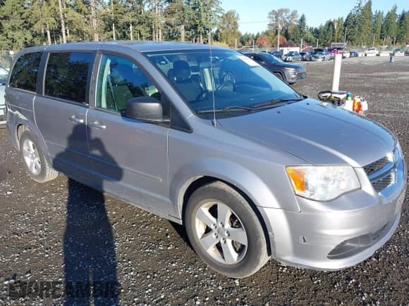 2013 Dodge Grand Caravan SE with VIN 2C4RDGBG6DR703399, listed as a IAAI auction lot 43230305 with 113,048 mi miles and . Bid and sale history available at DreamBid. Image 1.