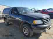 2002 Ford F-150 XL z VIN 1FTRF18232NA58109, wystawiony jako Copart lot #79080674 z przebiegiem 148 213 mil mil oraz Szkoda całkowita • Salvage title. Historia ofert i sprzedaży dostępna na DreamBid. Obrazek 4.
