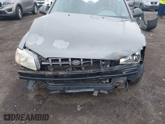 2002 Hyundai Accent GL z VIN KMHCG45C52U372587, wystawiony jako IAAI lot #42244428 z przebiegiem 43 538 mil mil oraz . Historia ofert i sprzedaży dostępna na DreamBid. Obrazek 6.