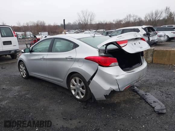 2013 Hyundai Elantra GLS z VIN KMHDH4AE2DU604123, wystawiony jako IAAI lot #38176314 z przebiegiem 144 871 mil mil oraz . Historia ofert i sprzedaży dostępna na DreamBid. Obrazek 3.