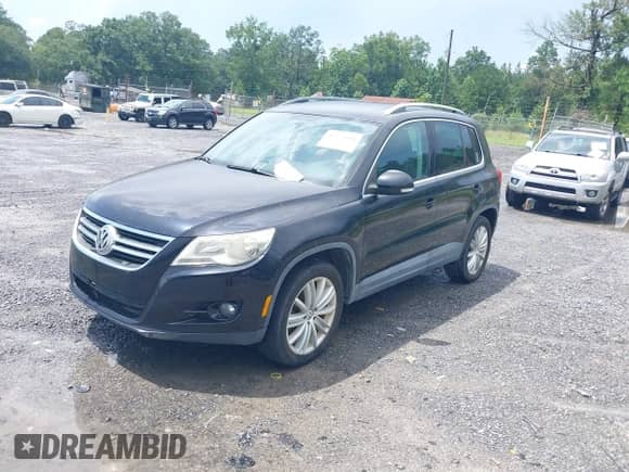 2011 Volkswagen Tiguan S with VIN WVGAV7AX2BW549477, listed as a IAAI auction lot 42923494 with 96,348 mi miles and . Bid and sale history available at DreamBid. Image 2.
