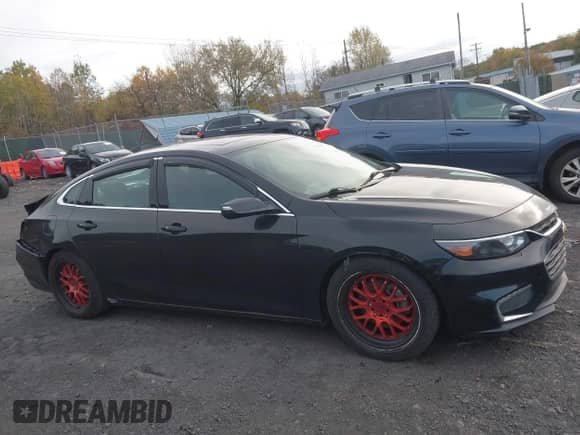 2018 Chevrolet Malibu LT z VIN 1G1ZD5ST3JF152636, wystawiony jako IAAI lot #43525579 z przebiegiem 135 976 mil mil oraz . Historia ofert i sprzedaży dostępna na DreamBid. Obrazek 13.