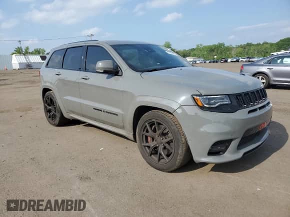2020 Jeep Grand Cherokee SRT with VIN 1C4RJFDJ8LC158048, listed as a Copart auction lot 57426205 with 52,979 mi miles and Salvage title. Bid and sale history available at DreamBid. Image 4.