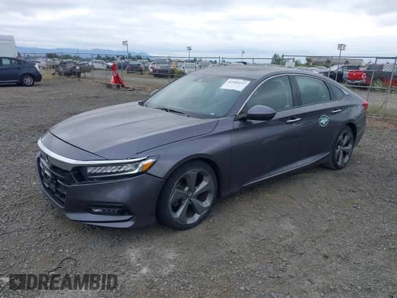 2018 Honda Accord Touring z VIN 1HGCV2F97JA031923, wystawiony jako IAAI lot #42509247 z przebiegiem 61 988 mil mil oraz . Historia ofert i sprzedaży dostępna na DreamBid. Obrazek 2.