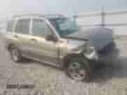2003 Chevrolet Tracker with VIN 2CNBJ13C936947062, listed as a Copart auction lot 59820603 with 65,344 mi miles and Salvage title. Bid and sale history available at DreamBid. Image 4.