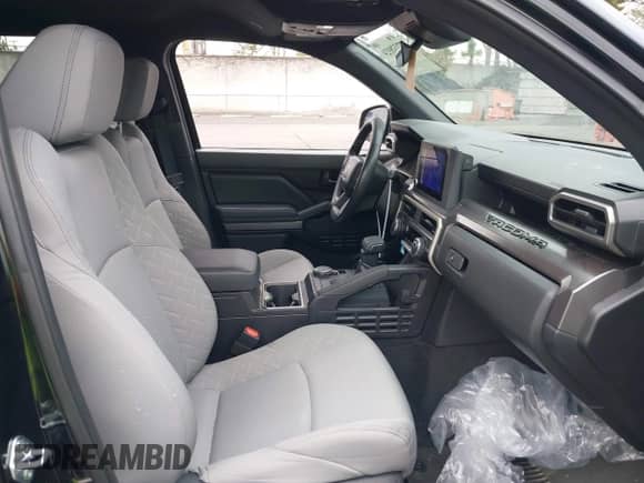 2024 Toyota Tacoma SR5 with VIN 3TMLB5JN8RM059015, listed as a IAAI auction lot 43328924 with 12,602 mi miles and . Bid and sale history available at DreamBid. Image 5.