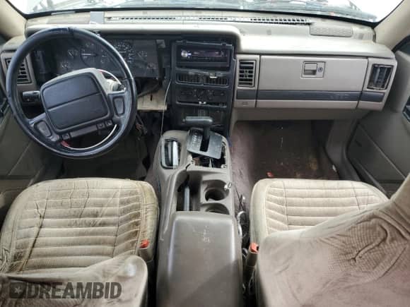 1995 Jeep Grand Cherokee Laredo with VIN 1J4GZ58S7SC743239, listed as a Copart auction lot 81717114 with 254,061 mi miles and Salvage title. Bid and sale history available at DreamBid. Image 8.