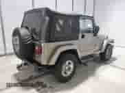 2003 Jeep Wrangler Sahara с VIN 1J4FA59S33P363830, выставлен на аукционе Copart как лот 62773325 с пробегом 114 286 миль миль и Чистый • Clean title. История ставок и продаж доступна на DreamBid. Изображение 3.