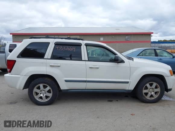 2009 Jeep Grand Cherokee Laredo with VIN 1J8GR48K89C526849, listed as a IAAI auction lot 43537654 with 214,796 mi miles and . Bid and sale history available at DreamBid. Image 14.
