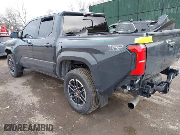 2024 Toyota Tacoma SR5 with VIN 3TYLB5JN1RT039046, listed as a IAAI auction lot 41610499 with 6,455 mi miles and . Bid and sale history available at DreamBid. Image 3.