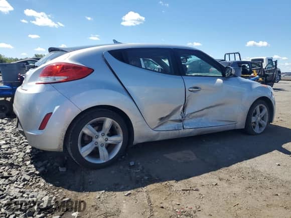 2014 Hyundai Veloster с VIN KMHTC6AD9EU199795, выставлен на аукционе Copart как лот 70213715 с пробегом 108 628 миль миль и Списание • Salvage title. История ставок и продаж доступна на DreamBid. Изображение 3.