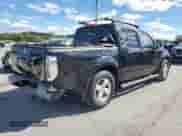 2006 Nissan Frontier SE with VIN 1N6AD07UX6C412495, listed as a Copart auction lot 84879235 with 257,704 mi miles and Salvage title. Bid and sale history available at DreamBid. Image 3.