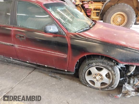 2004 Chevrolet Malibu Classic z VIN 1G1ND52F84M549946, wystawiony jako IAAI lot #42404927 z przebiegiem Nie podano mil oraz . Historia ofert i sprzedaży dostępna na DreamBid. Obrazek 14.