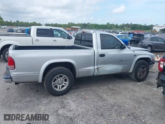 2002 Dodge Dakota with VIN 1B7FL36NX2S522194, listed as a IAAI auction lot 42366140 with 232,464 mi miles and . Bid and sale history available at DreamBid. Image 14.