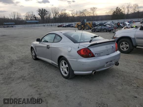 2003 Hyundai Tiburon GT с VIN KMHHN65F63U064962, выставлен на аукционе Copart как лот 44804045 с пробегом 186 171 миль миль и Списание • Salvage title. История ставок и продаж доступна на DreamBid. Изображение 2.