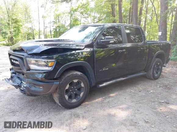 2019 Ram 1500 Rebel z VIN 1C6SRFLT5KN652309, wystawiony jako IAAI lot #42406112 z przebiegiem 130 590 mil mil oraz . Historia ofert i sprzedaży dostępna na DreamBid. Obrazek 2.