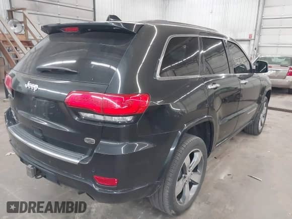 2015 Jeep Grand Cherokee Overland z VIN 1C4RJFCT7FC704149, wystawiony jako IAAI lot #42271696 z przebiegiem 127 825 mil mil oraz . Historia ofert i sprzedaży dostępna na DreamBid. Obrazek 4.