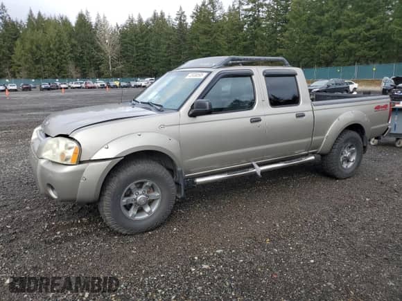 2003 Nissan Frontier XE with VIN 1N6ED29Y43C414977, listed as a Copart auction lot 43938595 with 212,303 mi miles and Salvage title. Bid and sale history available at DreamBid. Image 1.