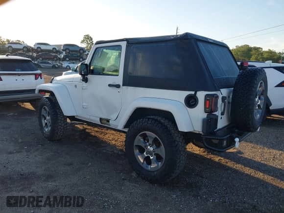 2018 Jeep Wrangler Sahara with VIN 1C4AJWBG2JL821132, listed as a IAAI auction lot 42523688 with 86,244 mi miles and . Bid and sale history available at DreamBid. Image 3.
