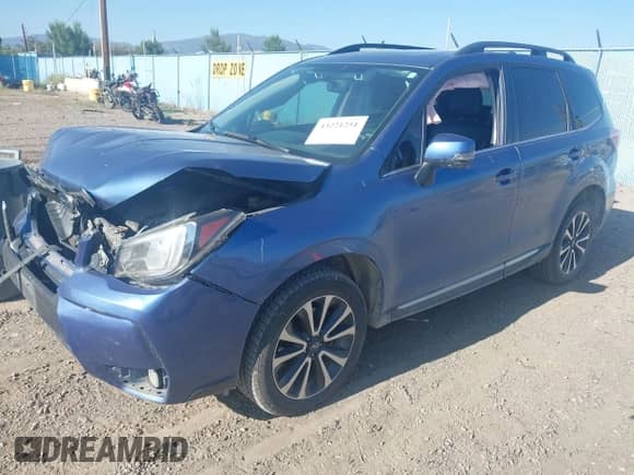 2017 Subaru Forester Touring z VIN JF2SJGWC9HH590231, wystawiony jako IAAI lot #43221251 z przebiegiem 110 560 mil mil oraz . Historia ofert i sprzedaży dostępna na DreamBid. Obrazek 2.