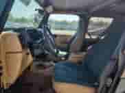 1997 Jeep Wrangler Sahara z VIN 1J4FY49S3VP519387, wystawiony jako Copart lot #63822395 z przebiegiem 187 884 mil mil oraz Szkoda całkowita • Salvage title. Historia ofert i sprzedaży dostępna na DreamBid. Obrazek 7.