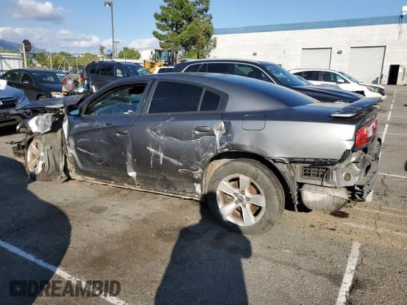 2012 Dodge Charger SXT с VIN 2C3CDXHG6CH137816, выставлен на аукционе Copart как лот 86896745 с пробегом 165 928 миль миль и Списание • Salvage title. История ставок и продаж доступна на DreamBid. Изображение 2.