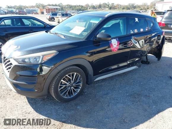 2019 Hyundai Tucson Sport z VIN KM8J33AL5KU902933, wystawiony jako IAAI lot #41286316 z przebiegiem 73 799 mil mil oraz . Historia ofert i sprzedaży dostępna na DreamBid. Obrazek 2.