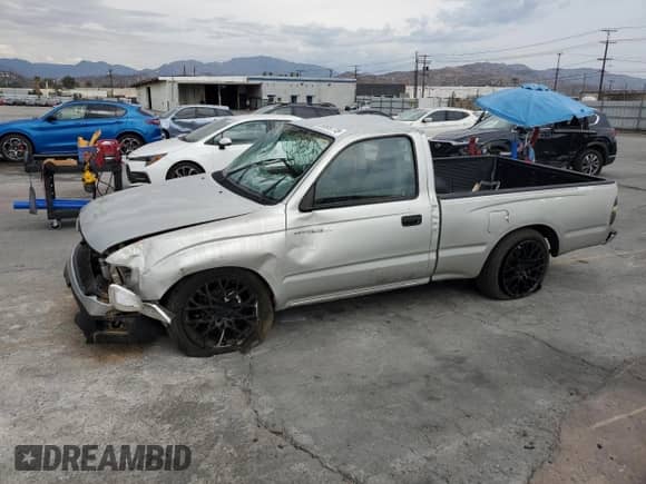 2002 Toyota Tacoma with VIN 5TENL42N82Z080549, listed as a Copart auction lot 80899715 with 115,239 mi miles and Salvage title. Bid and sale history available at DreamBid. Image 1.