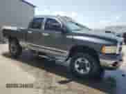 2003 Dodge 3500 ST with VIN 3D7LU38C63G796874, listed as a Copart auction lot 64927615 with 247,138 mi miles and Salvage title. Bid and sale history available at DreamBid. Image 4.