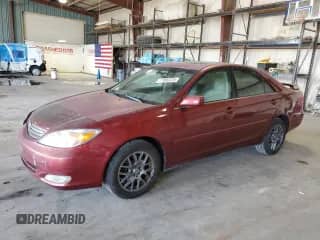 2004 Toyota Camry SE with VIN 4T1BA32K14U502001, listed as a Copart auction lot 71993325 with 214,787 mi miles and Salvage title. Bid and sale history available at DreamBid. Image 1.