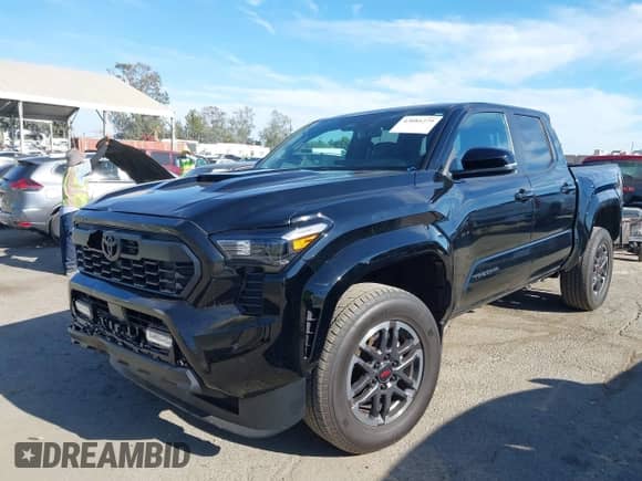 2024 Toyota Tacoma SR5 with VIN 3TMKB5FN3RM000779, listed as a IAAI auction lot 43081279 with 24,906 mi miles and . Bid and sale history available at DreamBid. Image 2.
