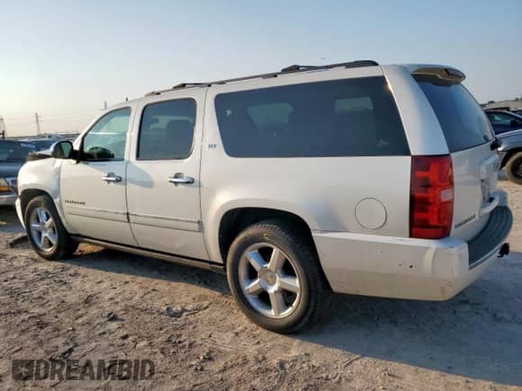 2011 Chevrolet Suburban LTZ with VIN 1GNSCKE01BR130492, listed as a Copart auction lot 68272725 with 199,542 mi miles and Salvage title. Bid and sale history available at DreamBid. Image 2.