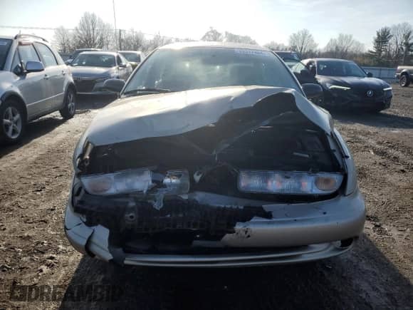 1999 Saturn SL with VIN 1G8ZK5270XZ212874, listed as a Copart auction lot 85317464 with 153,477 mi miles and Salvage title. Bid and sale history available at DreamBid. Image 5.